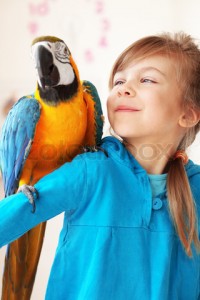 Child with ara parrot