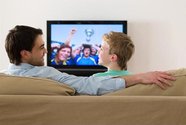 father_and_son_watching_a_football_match_IE321-043